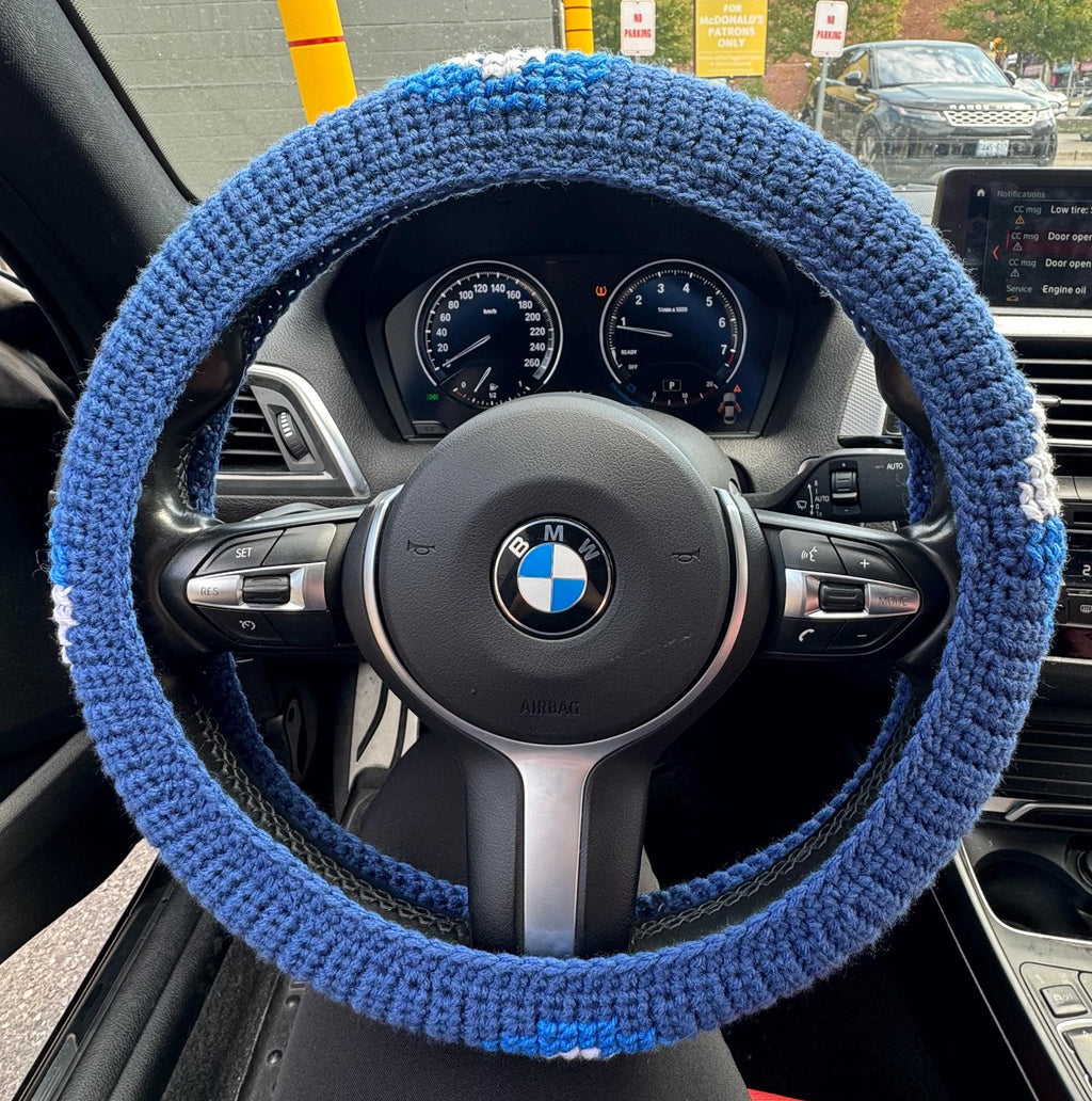 Crochet steering wheel cover.