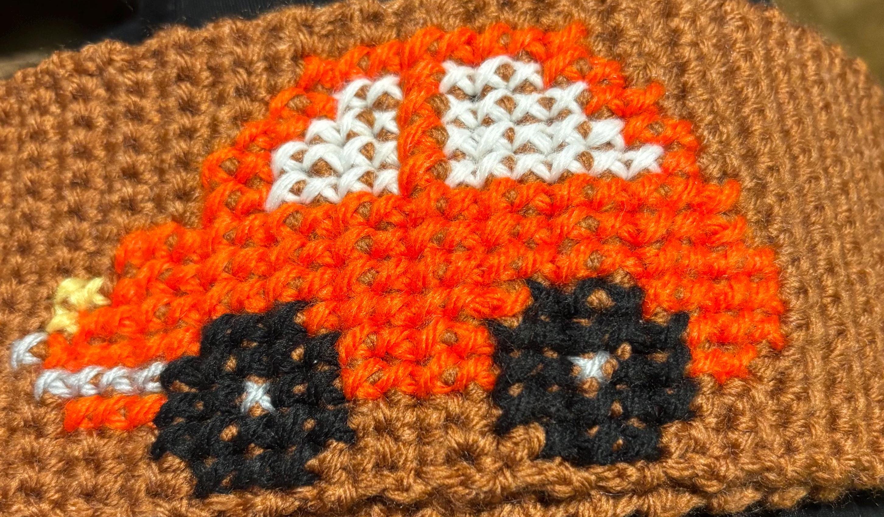 Crochet steering wheel cover.