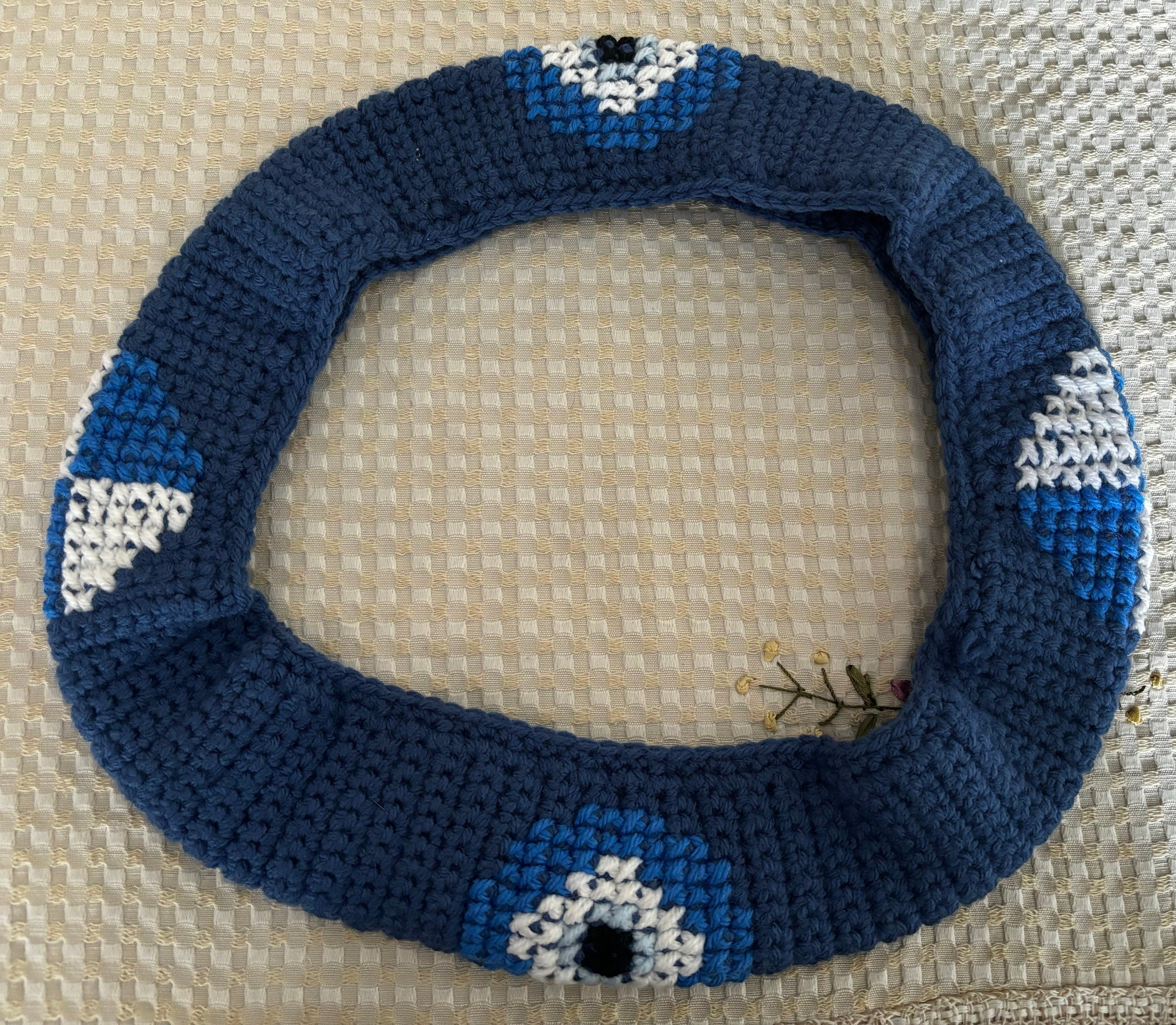 Crochet steering wheel cover.