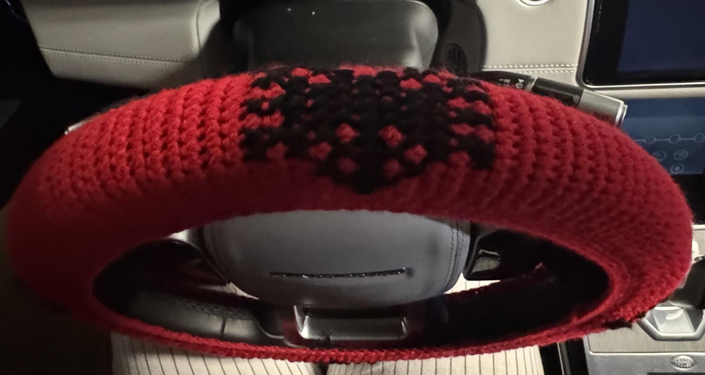 Crochet steering wheel cover.