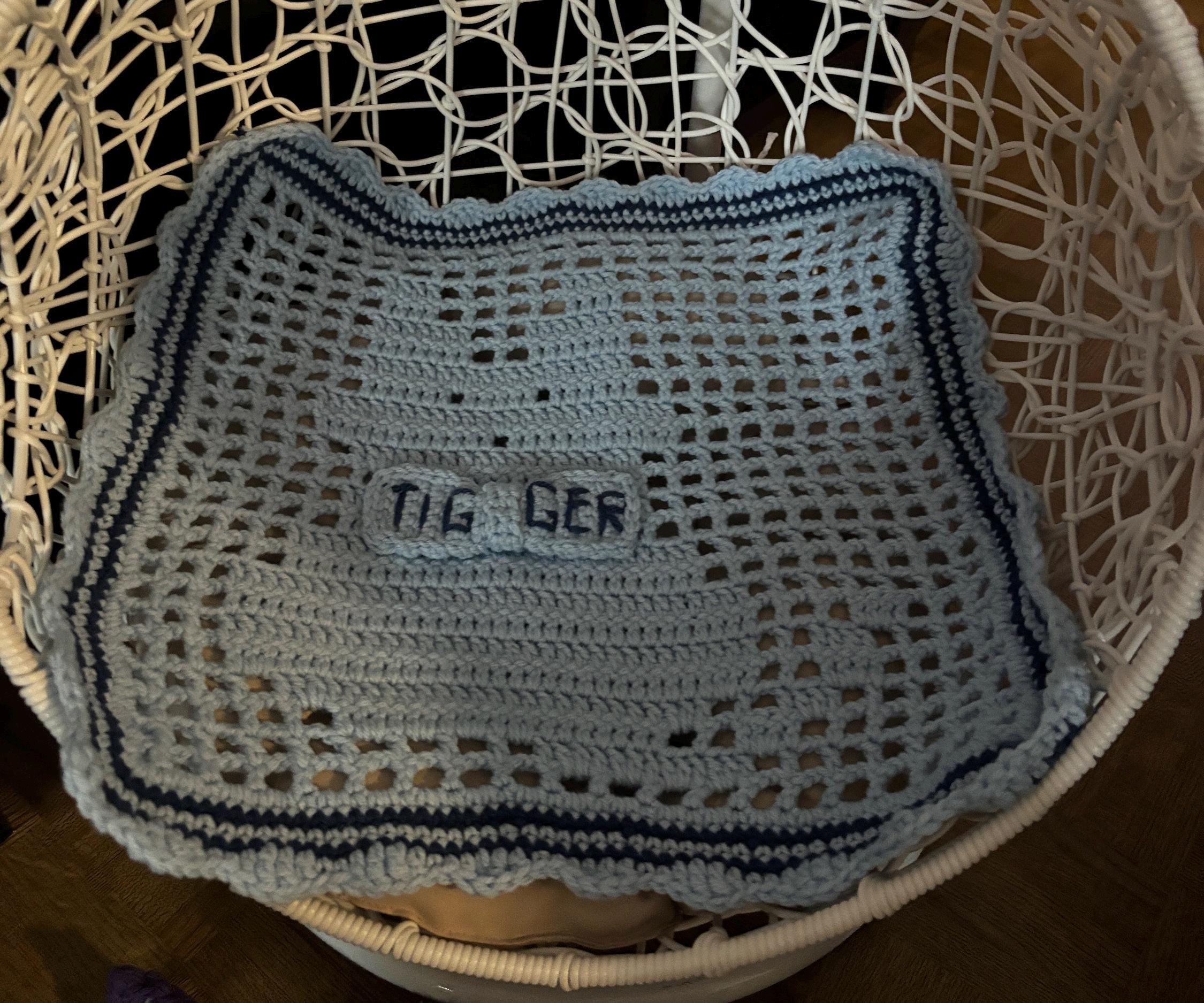 Crochet pet blanket.