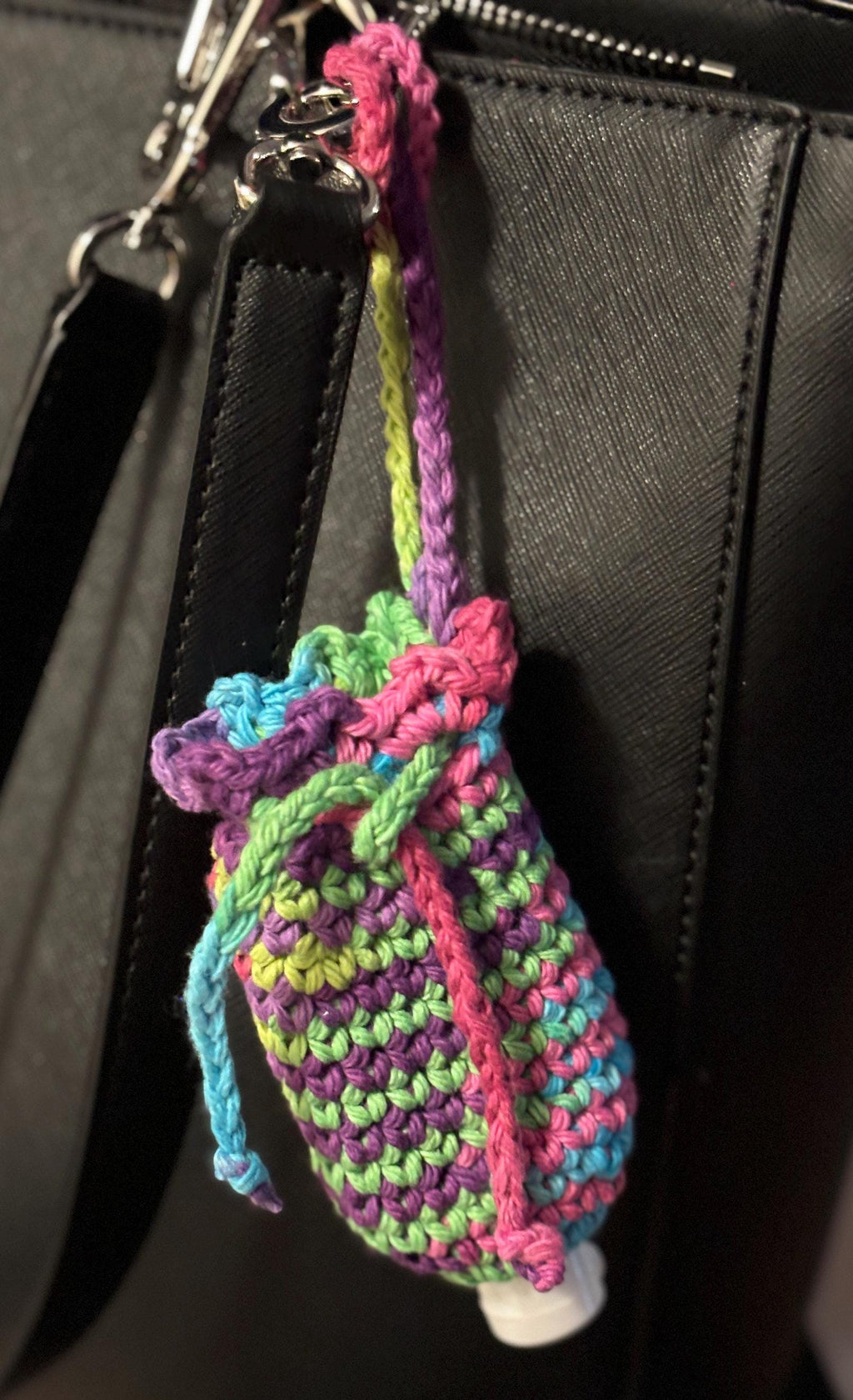 Rainbow crochet coin purse and hand sanitizer holder set.