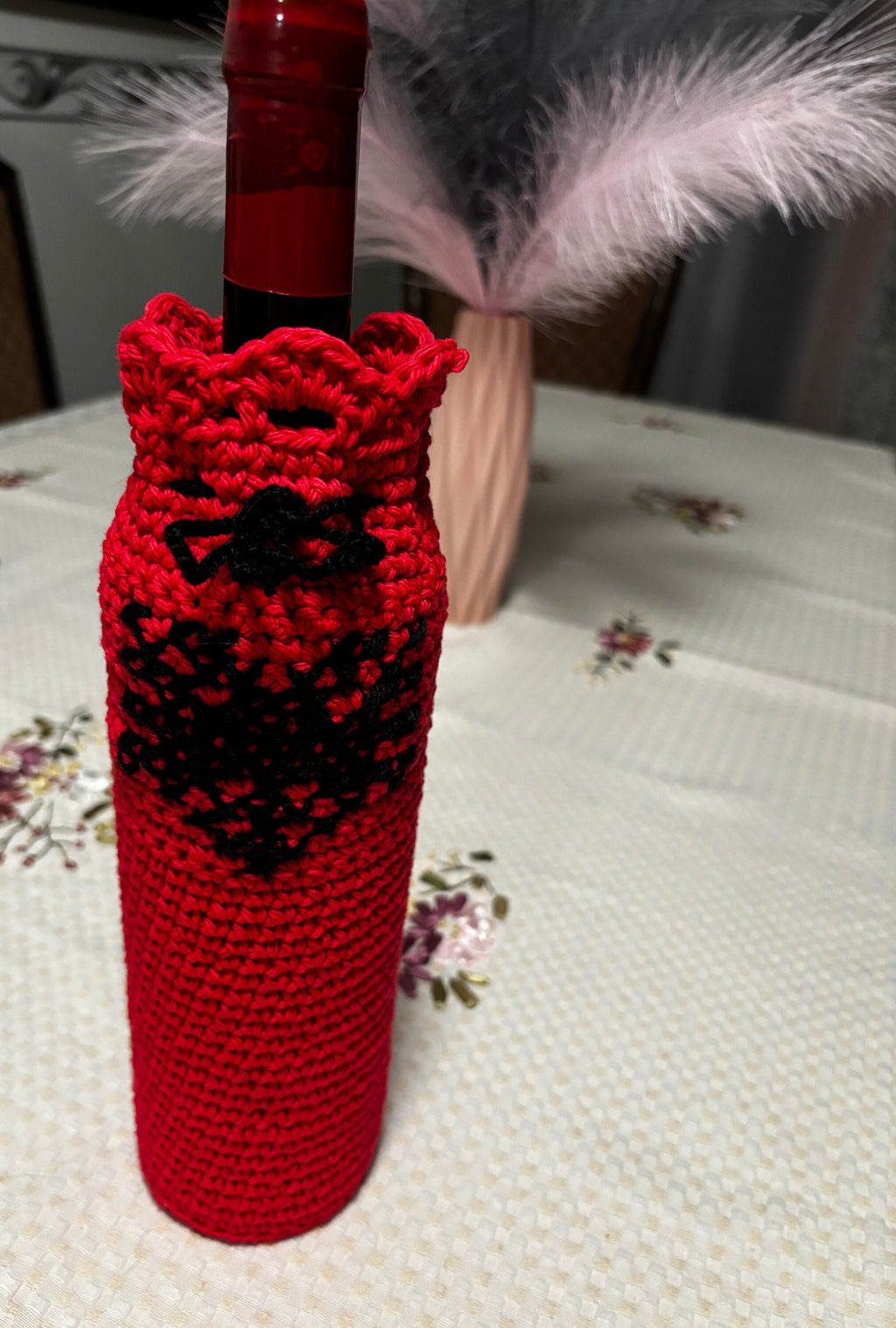 Crochet wine bottle sleeve.