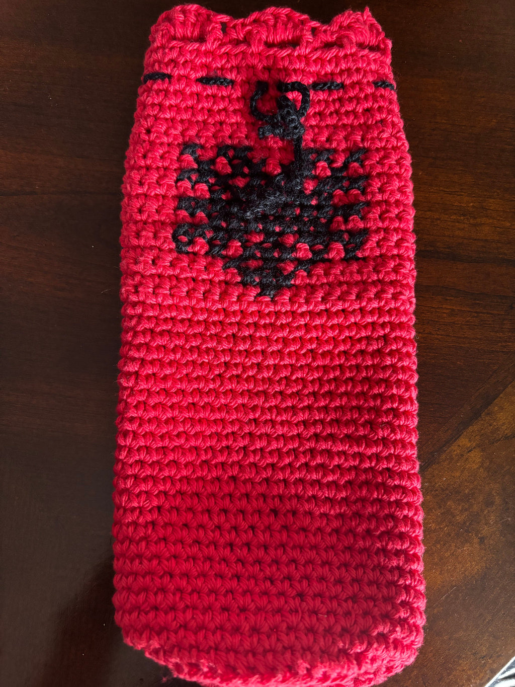 Crochet wine bottle sleeve.