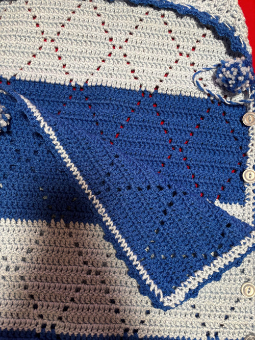 Crochet baby hooded envelope blanket.