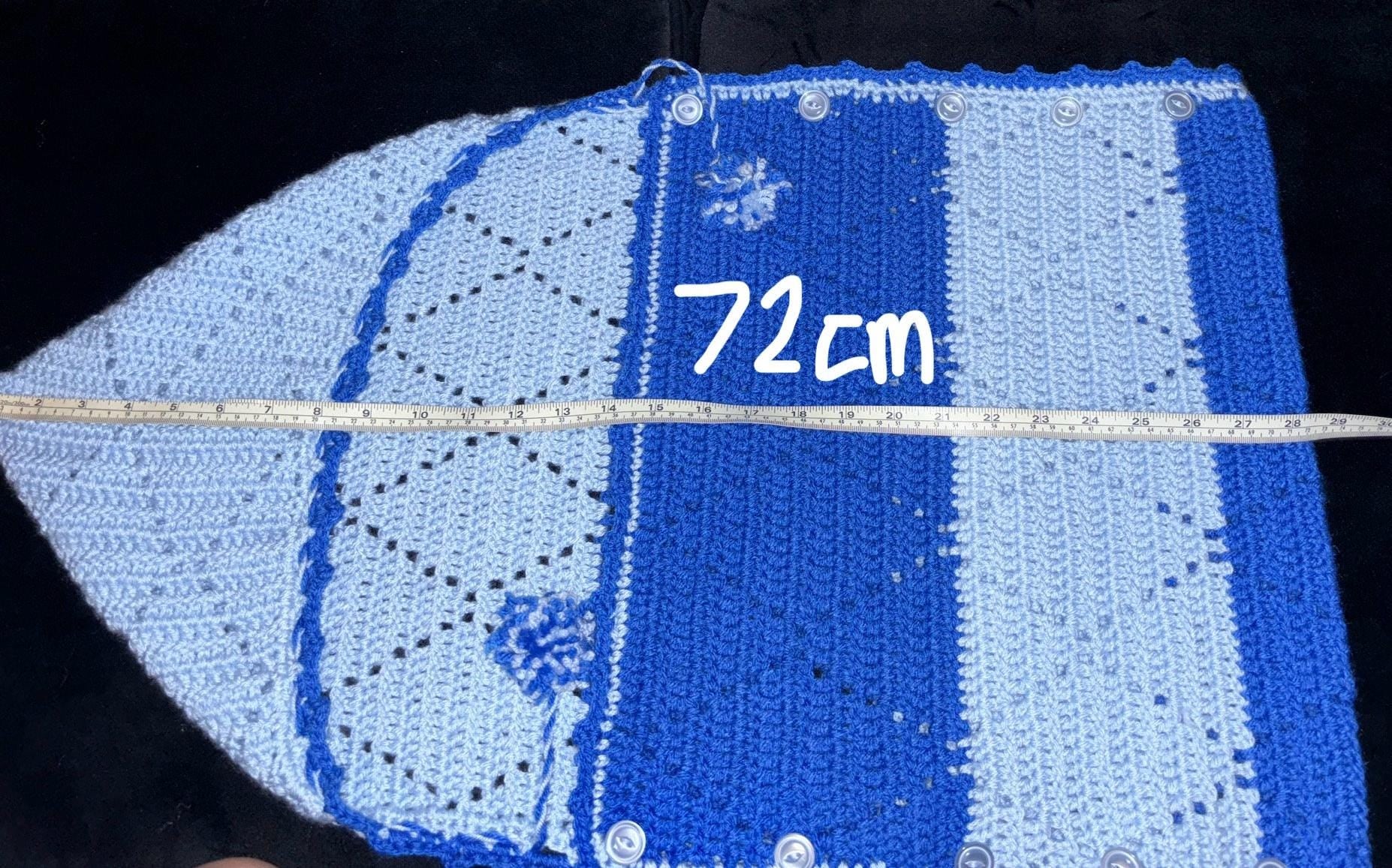 Crochet baby hooded envelope blanket.
