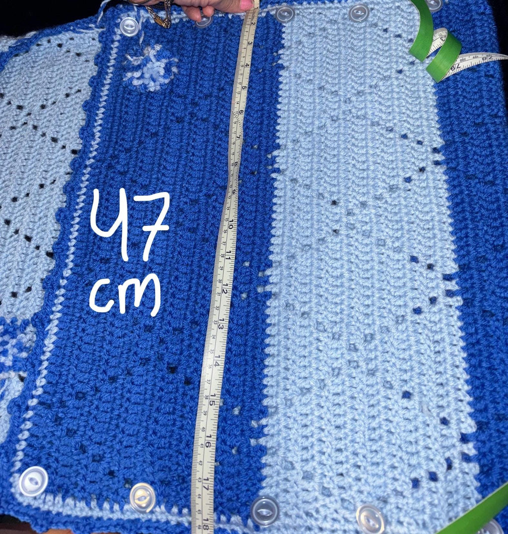 Crochet baby hooded envelope blanket.