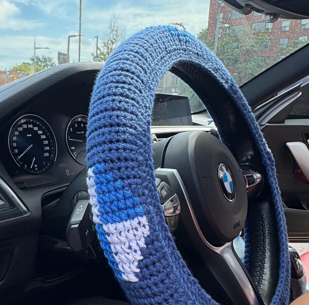 Crochet steering wheel cover.