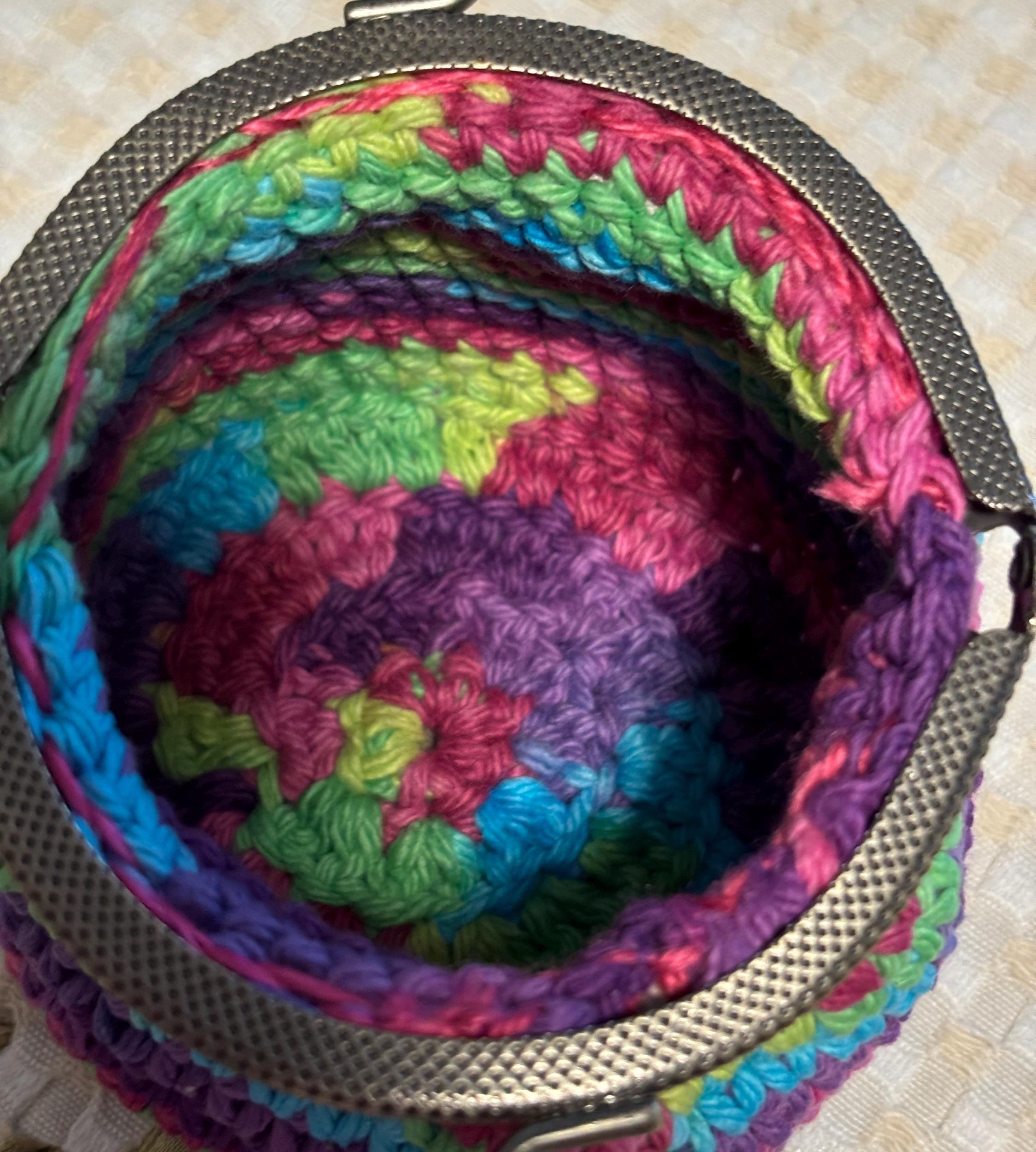 Rainbow crochet coin purse and hand sanitizer holder set.