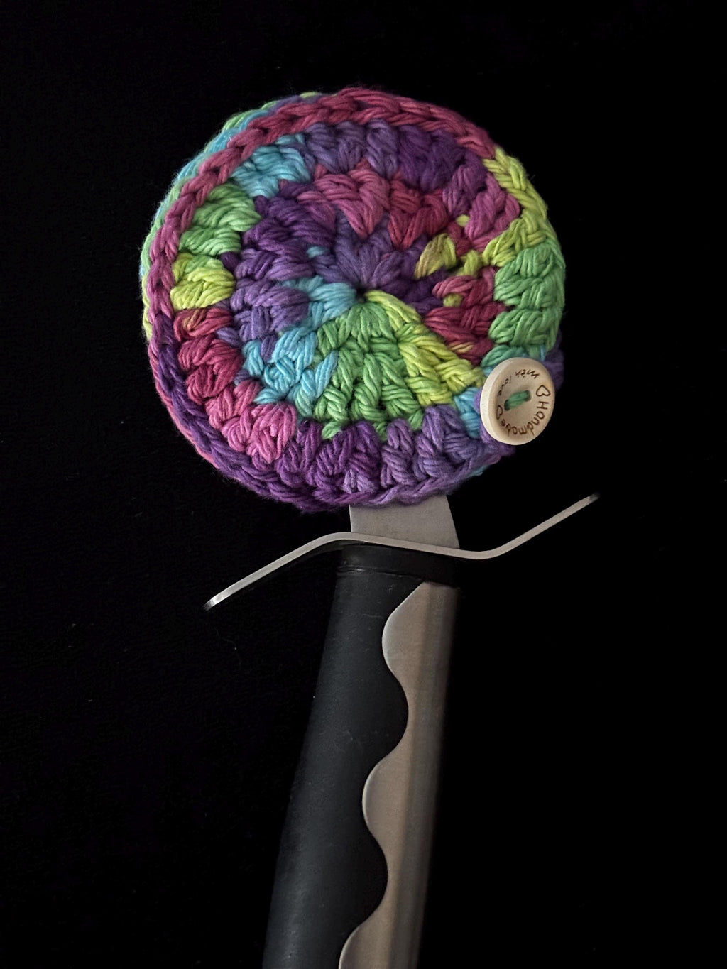Crochet pizza cutter cover.
