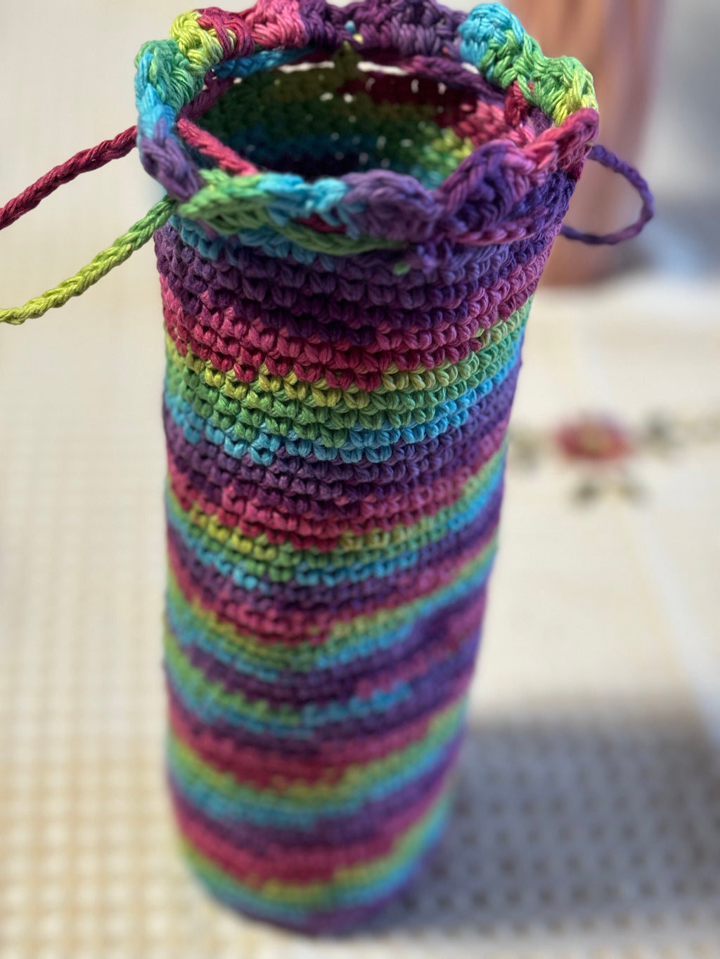 Crochet wine bottle sleeve.