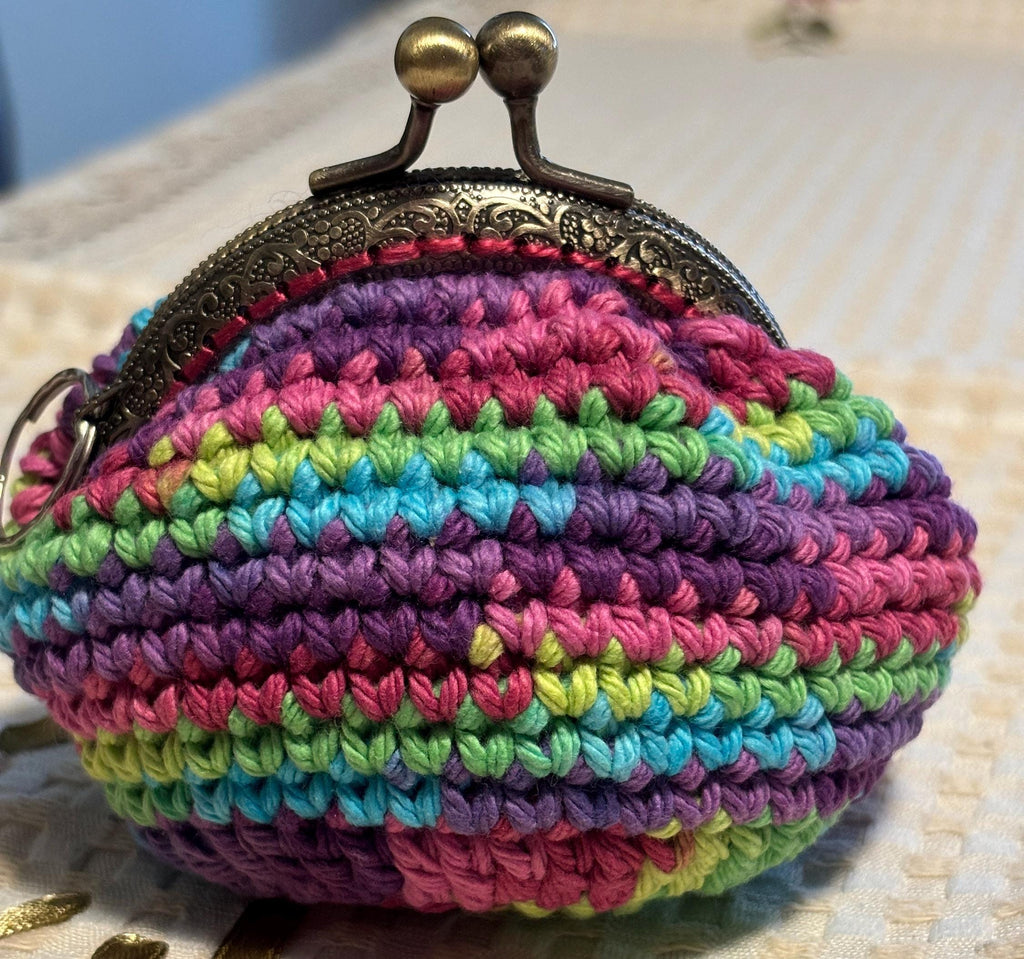 Rainbow crochet coin purse and hand sanitizer holder set.