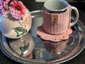 Crochet mug sleeve and coaster set.