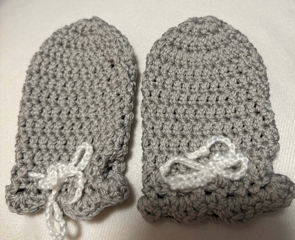 Crochet baby hat, mittens and socks set.