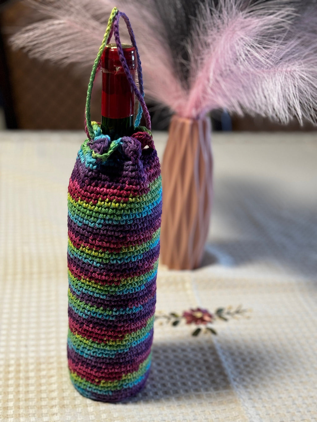 Crochet wine bottle sleeve.